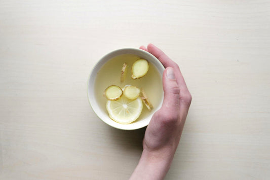 Ginger tea against white table