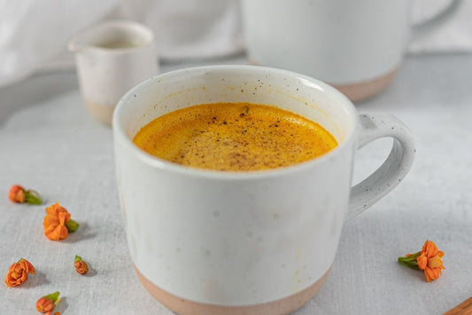 turmeric latte with black pepper in white cup