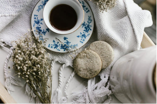 earl grey tea with cookies on cloth table