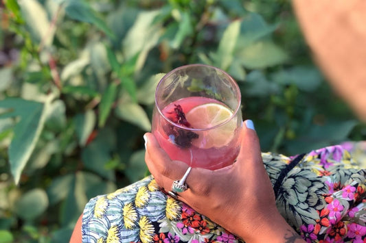 woman drinking iced hibiscus tea