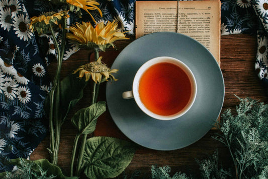 oolong tea on wooden table with flowers